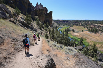 Wall Mural - Hikers on Misery Ridge Trail in Smith Rock State Park near Terrebonne, Oregon on a cloudless summer day.