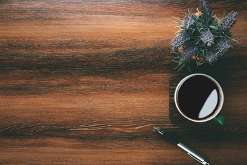 Aufkleber - Wood office desk table with cup of coffee, pen and plant pot. Top view with copy space, flat, lay.