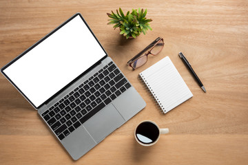 Aufkleber - Laptop computer with blank mock up screen is on top wooden office desk table with cup of black coffee and supplies.top view and copy space for text or design.