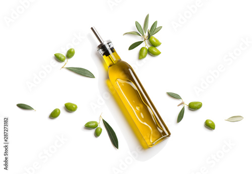 Cuadros en Lienzo Olive oil in bottle and fresh olives. Above view.