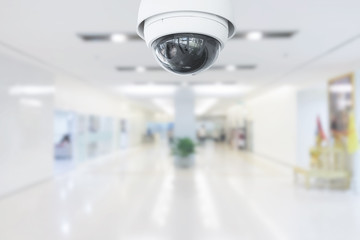 CCTV Security Camera operating in hospital on blur background.