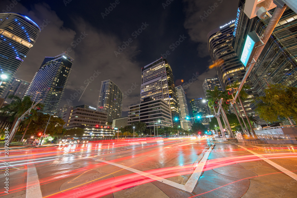Brickell Avenue business district at night with trailing car lights - obrazy, fototapety, plakaty 