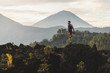 Man doing stretching and preparing for workout and running outdoors. Amazing mountain view on background. Adventure sports concept.