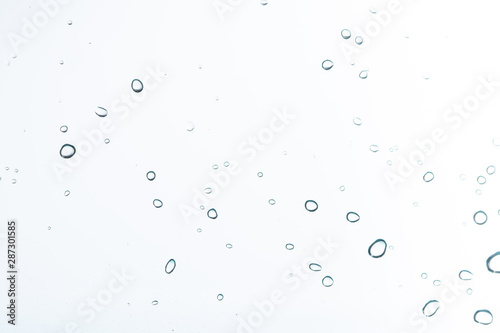 Photo: Water droplets on a white background Water droplets on a white background