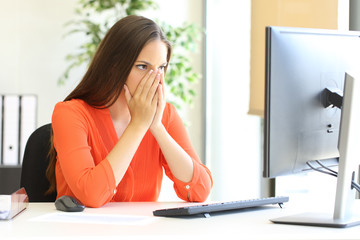 Wall Mural - Worried businesswoman discovering mistake on computer