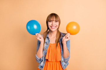 Poster - Portrait of lovely charming youth millennial hold hand she her baloon tails positive good-looking dressed orange skirt dress isolated pastel background