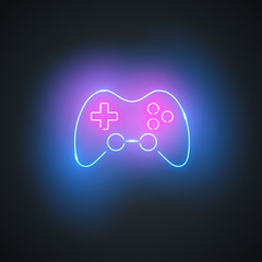 Poster - Neon gamepad. Glowing gamepad sign on black background. Colorful and bright gaming joystick symbol. Vector design element.