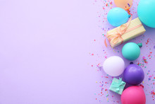 Composition With Balloons, Gifts And Place For Text On Color Background