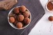 © Pixel-Shot - Tasty sweet truffles in bowl on table