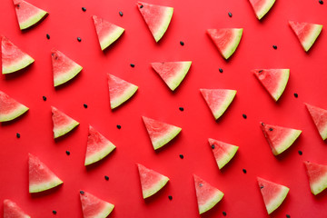 Many slices of watermelon on color background