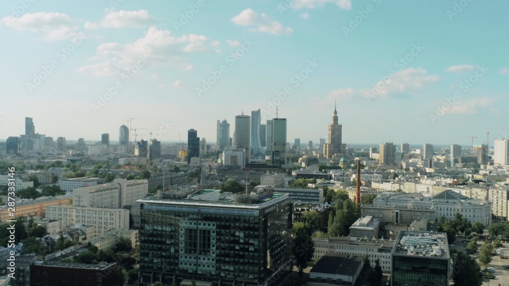 Aerial View of Warsaw City - Capital of Poland - with Skyscrapers, Palace of Culture and Science and Office Buildings on Summer Day - obrazy, fototapety, plakaty 