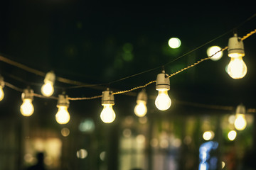 Fototapete - outdoor party string lights glowing at night