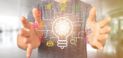 Poster - Businessman holding a Bulb lamp idea concept with start up icon connected 3d rendering