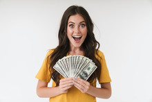 Young Girl Isolated Over White Wall Background Holding Money.