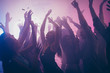 Photo of many birthday event people dancing purple lights confetti flying enjoy nightclub hands raised formal wear outfit