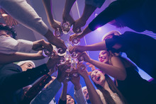 Low Below Angle View Of Nice Attractive Cheerful Cheery Girls And Guys Having Fun Rest Relax Clinking Wineglass Congrats Corporate Event Feast Celebratory In Luxury Place Nightclub Lights Indoors