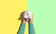 © Tierney - Person holding a piggy bank from above