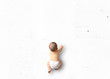 © Zarya Maxim - Cute baby crawling on the floor top view