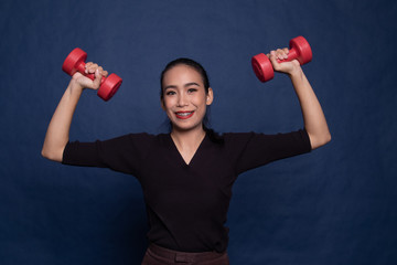 Healthy Asian woman with dumbbells.