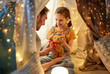 © Syda Productions - family, hygge and people concept - happy father with teddy bear toy and little daughter playing in kids tent at night at home