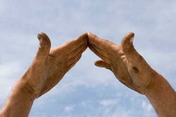 Hands making the shape of a house. Building. Roof