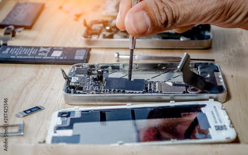 Cuadros en Lienzo Iphone motherboard repairs into the motherboard for smartphone By professional t