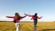 © zoteva87 - children play toy airplane. teenagers want to become pilot and astronaut. Happy girls run with toy plane at sunset on field. concept of happy childhood. Girls dream of flying and becoming a pilot.