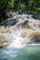 Turquoise river fall flowing over limestone