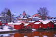 Old historic Porvoo, Finland with wooden houses and medieval stone and brick Porvoo Cathedral under white snow in winter