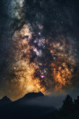 Wall Mural - milky way galaxy in universe astrophotography. silhouettes of mountains and trees. stars and nebula 