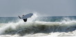 © Dmitri Kotchetov - A Surfer jumps a big Wave At Newport Beach In California