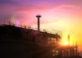 Wall Mural - Silhouette of building construction site on heavy industry and background sunset pastel