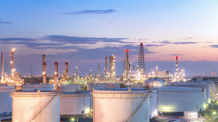 Close up Aerial view at oil and gas industrial,Oil refinery plant form industry,Refinery factory and oil storage tank with sunset