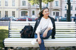 © shurkin_son - People, lifestyle, age, urban street style and fashion concept. Outdoor image of gorgeous attractive woman pensioner in trendy clothes waiting for friend on bench in park, enjoying nice sunny day