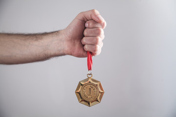 Hand showing medal. Sport, Winner, Success