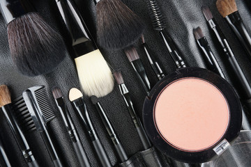 Wall Mural - Professional makeup tools. Makeup tools brushes, powder and lipstic. Top view. Flat lay. Selective focus