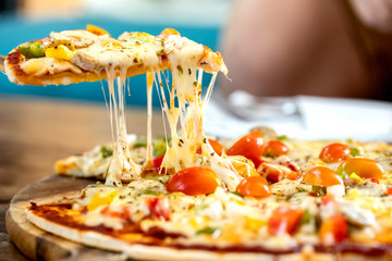 pepperoni pizza on wooden board