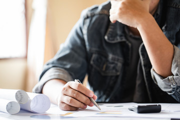 Business man working at office with laptop and documents on his desk