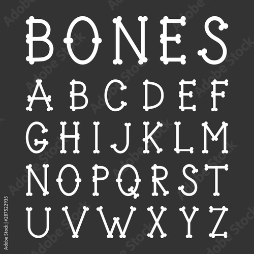Cuadros en Lienzo Alphabet made of bones on a black background