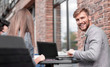© ASDF - employees at a meeting in a street cafe