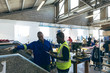 © Wavebreak Media - Two men working together in a sports equipment factory