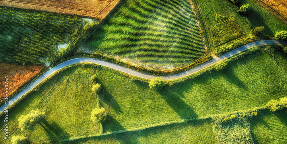 Drone aerial view - windy road in summer - obrazy, fototapety, plakaty 
