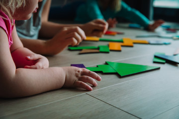 Poster - teacher and kids play with puzzle, doing tangram