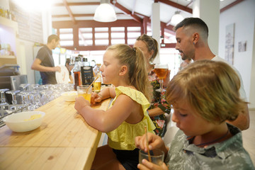 Family with children in a restaurant bar