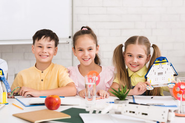 Poster - Pupils building robots in after school stem class