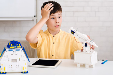 Poster - Shocked schoolboy made mistake when creating robot at stem class