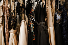 Luxurious Evening Night Out Sparkling Dresses Hanging On The Rack. High Fashion Concept, Haute Couture, Designer 