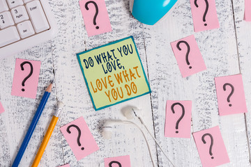 Text sign showing Do What You Love Love What You Do. Business photo showcasing you able doing stuff you enjoy it to work in better places then Writing tools, computer stuff and scribbled paper on top