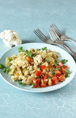 Wall Mural - keto recipe. chicken and cauliflower rice. low carbohydrates, lots of protein. protein nutrition. stewed with celery and carrots.