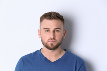 Poster - Portrait of handsome serious man on white background